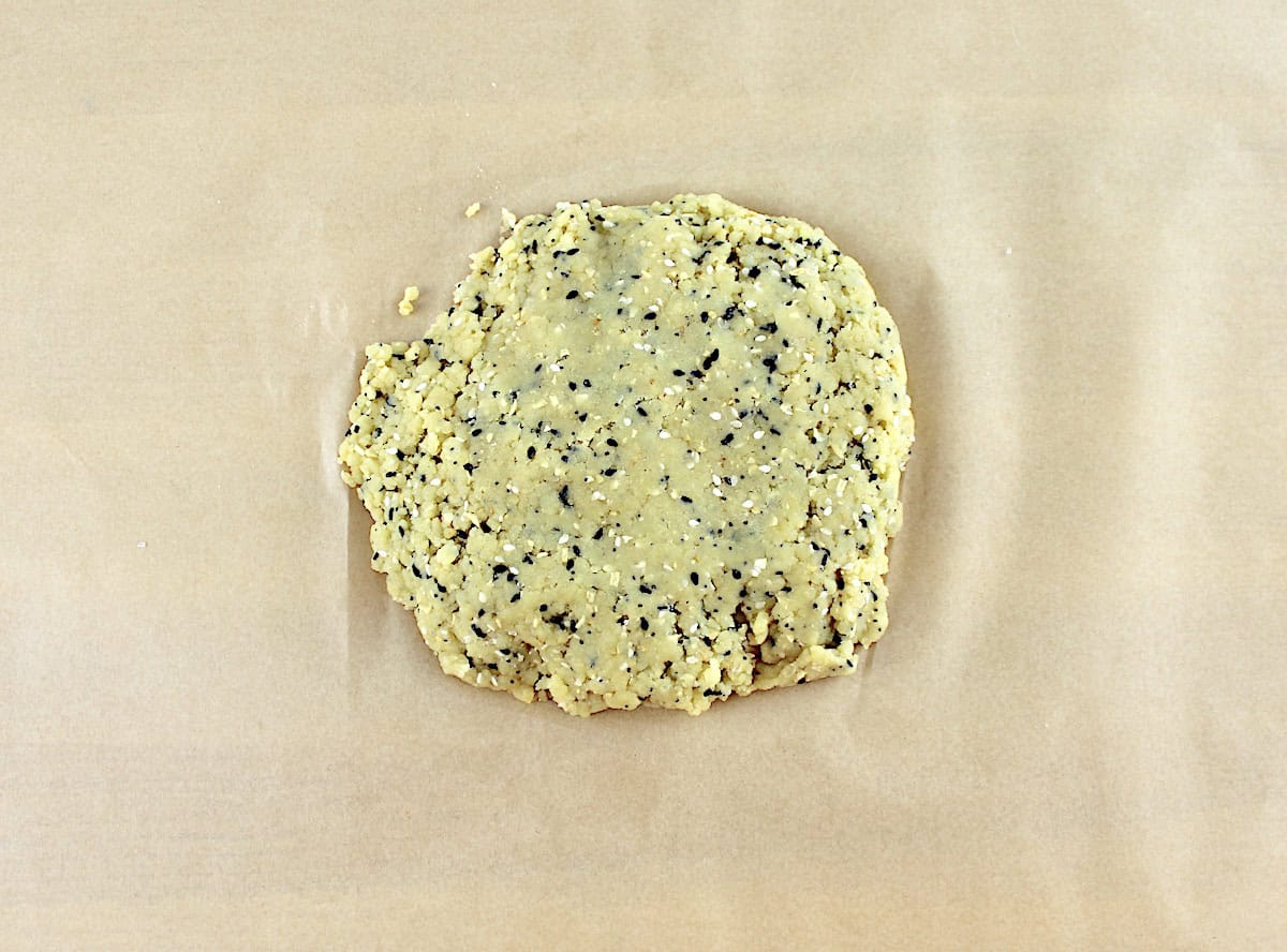 Everything Bagel Crackers dough on parchment paper