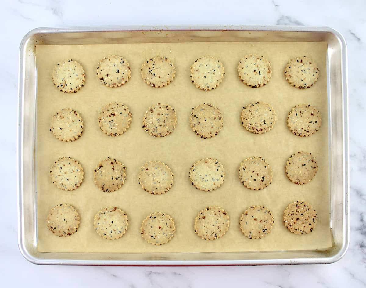 Everything Bagel Crackers baked on sheet pan with parchment paper