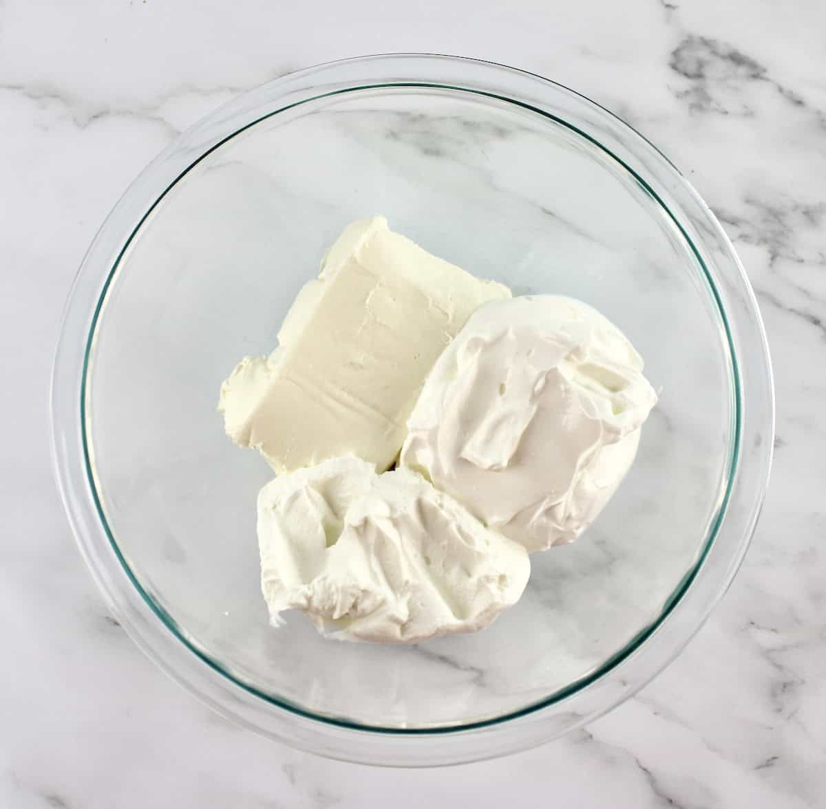 cream cheese, Greek yogurt and sour cream in glass bowl unmixed