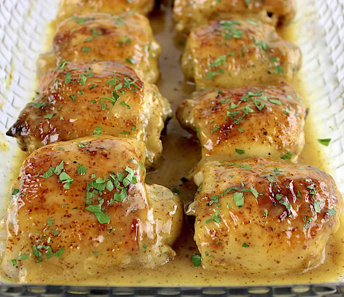 8 Honey Mustard Baked Chicken Thighs in glass casserole