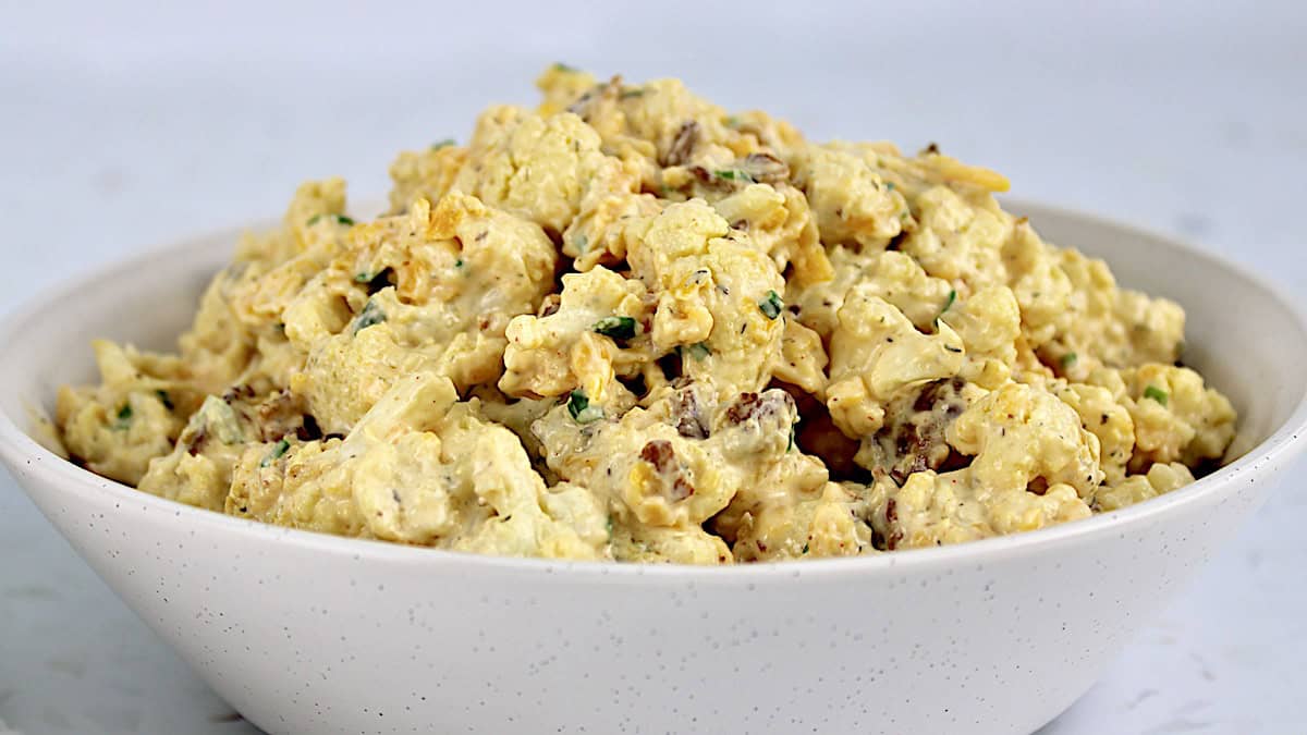 closeup of Loaded Cauliflower Salad in beige bowl