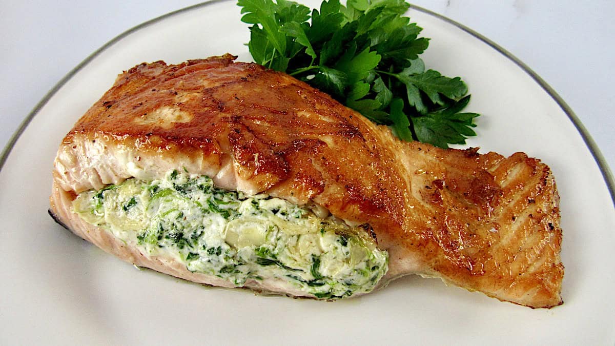 stuffed salmon on plate with parsley