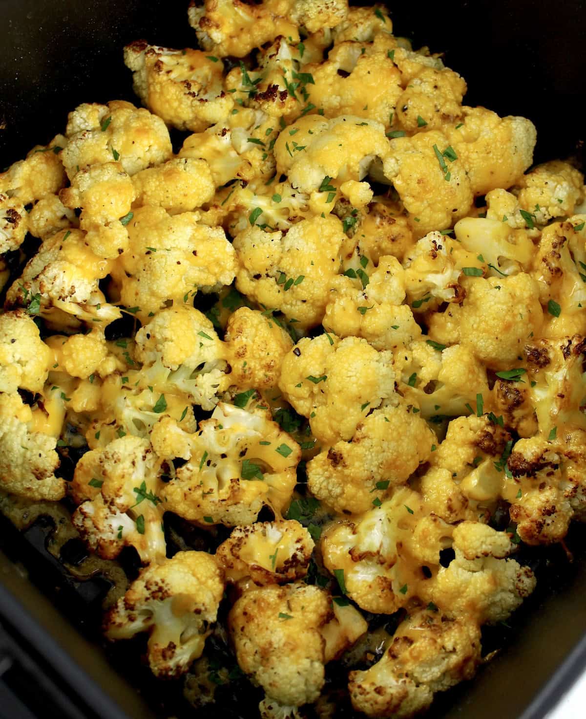 Air Fryer Cheesy Cauliflower with chopped parsley on top