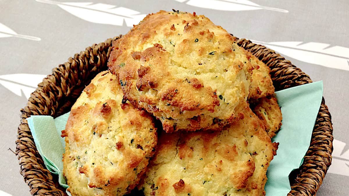 basket with bacon cheddar drop biscuits stacked up