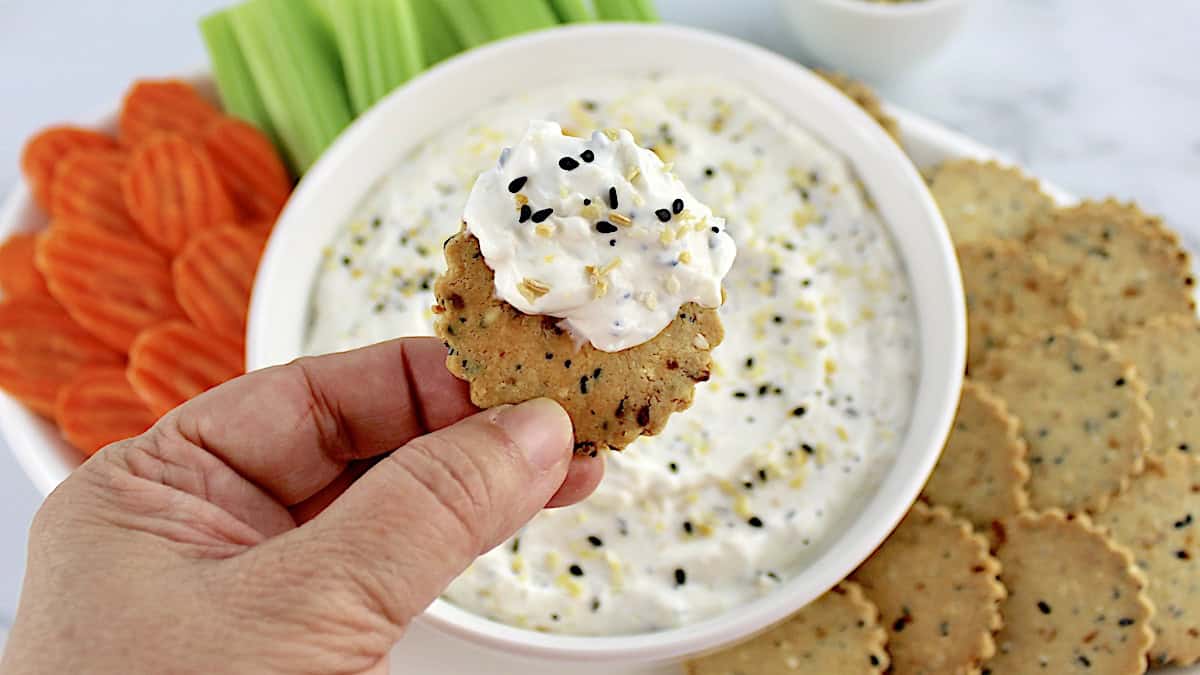 holding up everything cracker with dip