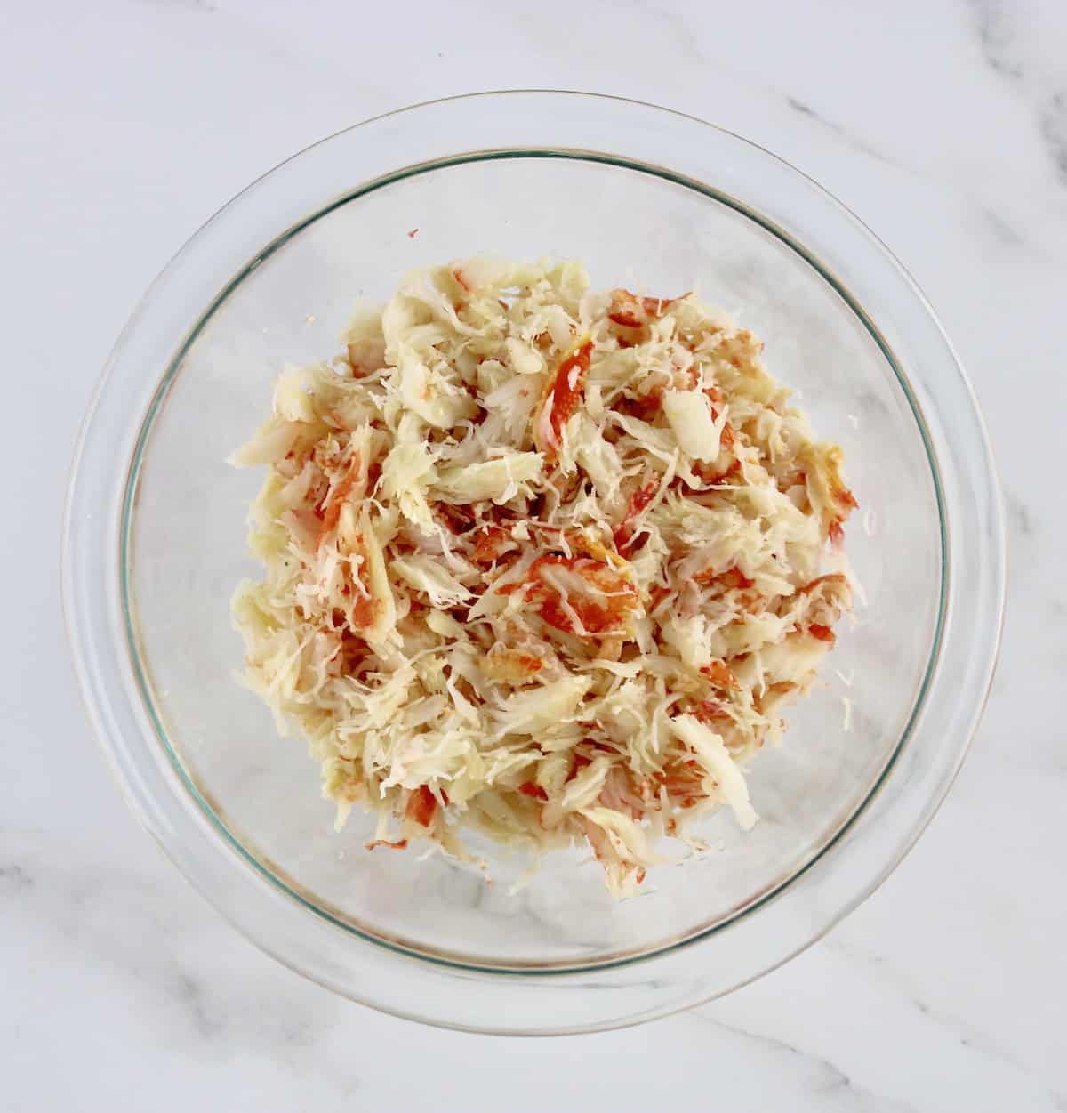 snow crab legs meat in glass bowl