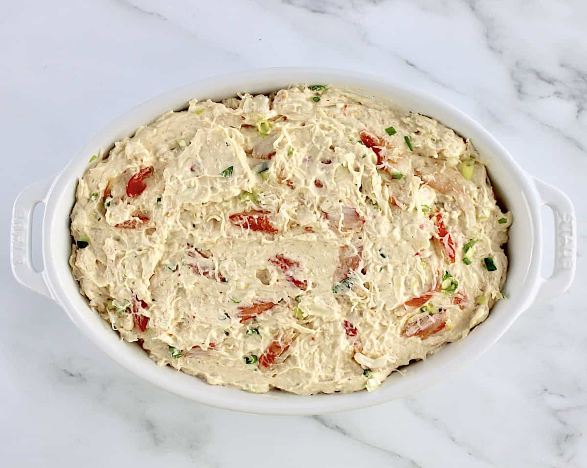 Hot Crab Dip in white oval casserole unbaked