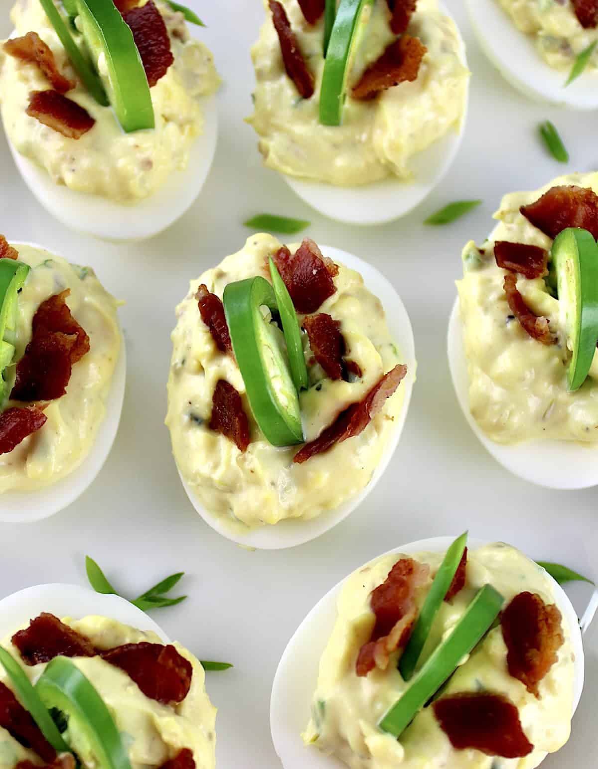 overhead closeup of Jalapeño Popper Deviled Eggs on white platter