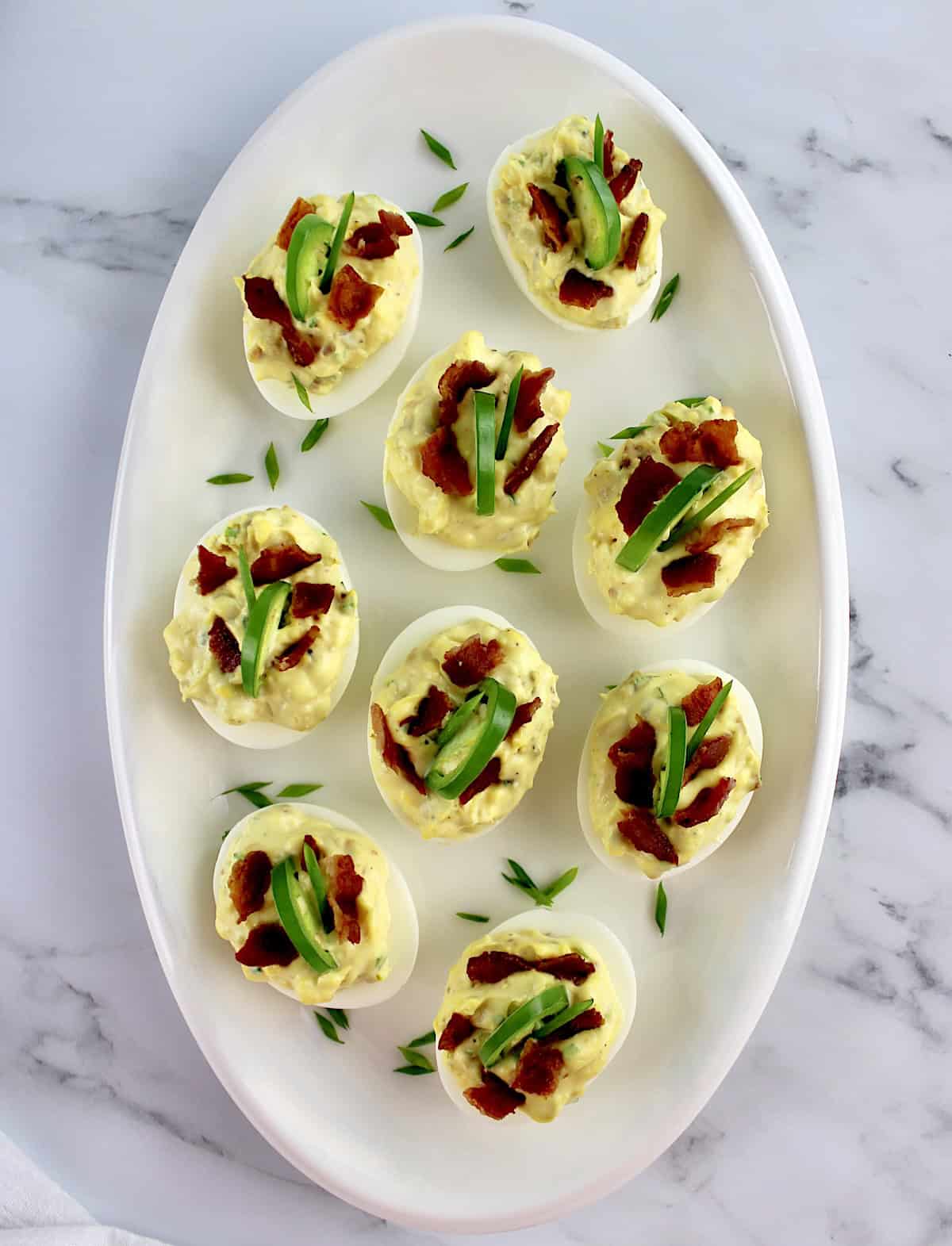 overhead view of Jalapeño Popper Deviled Eggs on white oval platter