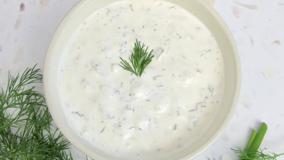 tartar sauce in bowl with dill on top