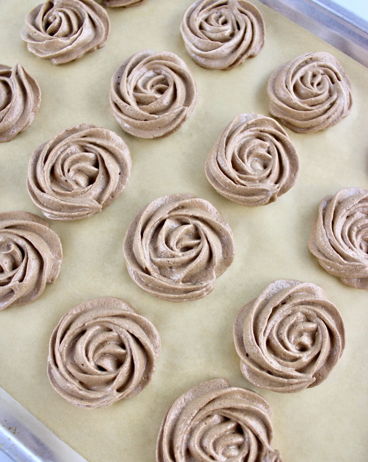 Mocha Meringue Cookies on parchment paper lined baking sheet unbaked