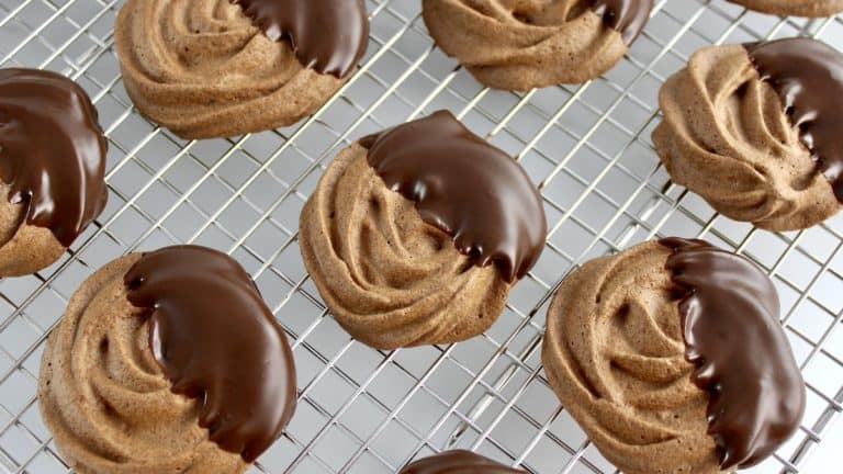 chocolate dipped Mocha Meringue Cookies on cooling rack