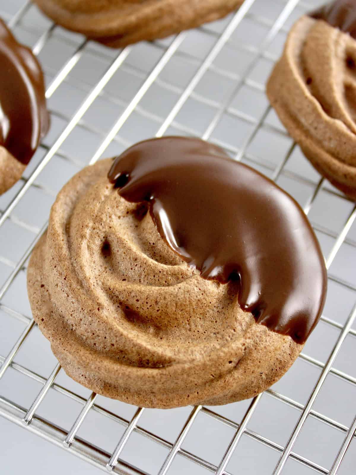 closeup of chocolate dipped Mocha Meringue Cookie