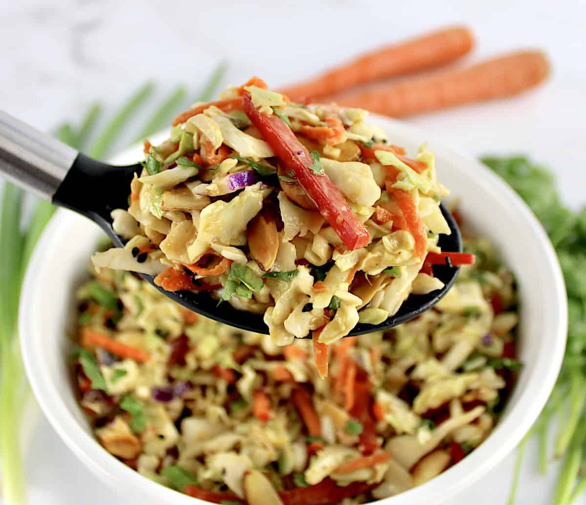 Peanut Ginger Slaw in serving spoon