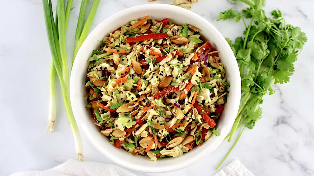 overhead view of Peanut Ginger Slaw in white bowl