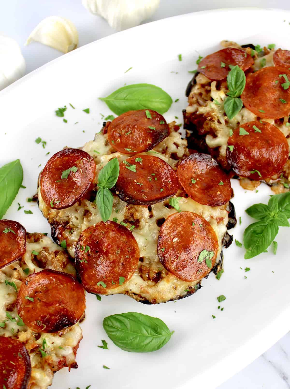 3 Portobello Mushroom Mini Pizzas on white plate