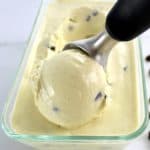 Vanilla Chocolate Chip Ice Cream in glass container with scoop