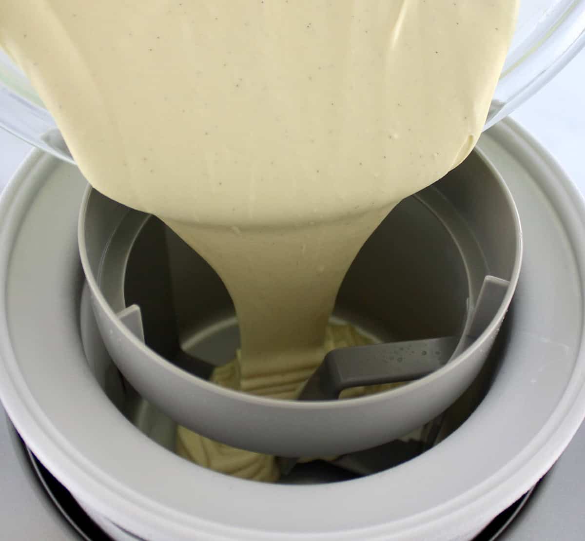 Vanilla Chocolate Chip Ice Cream custard being poured into ice cream maker