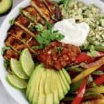 Chicken Fajita Bowl with dollop of sour cream and salsa