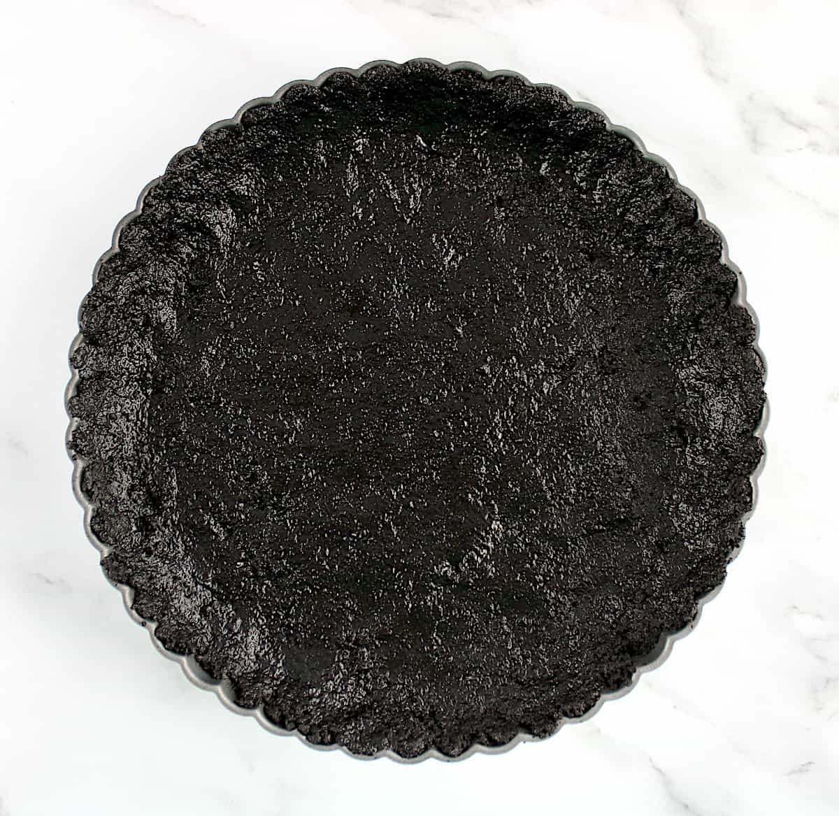 keto chocolate oreo crust in tart pan