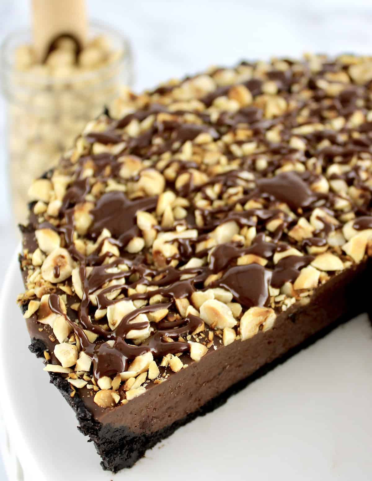 closeup of Chocolate Hazelnut Tart with slice missing