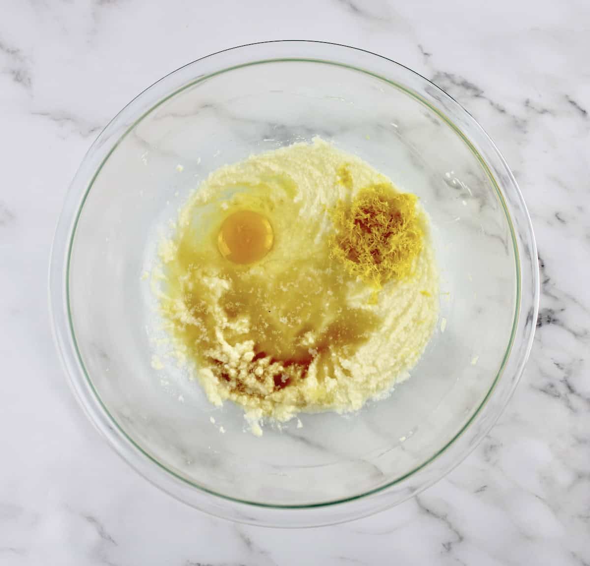 Lemon Ricotta Cookies wet ingredients unmixed in glass bowl