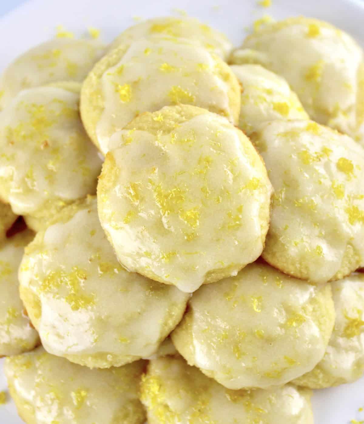 Lemon Ricotta Cookies stacked up with glaze on tops