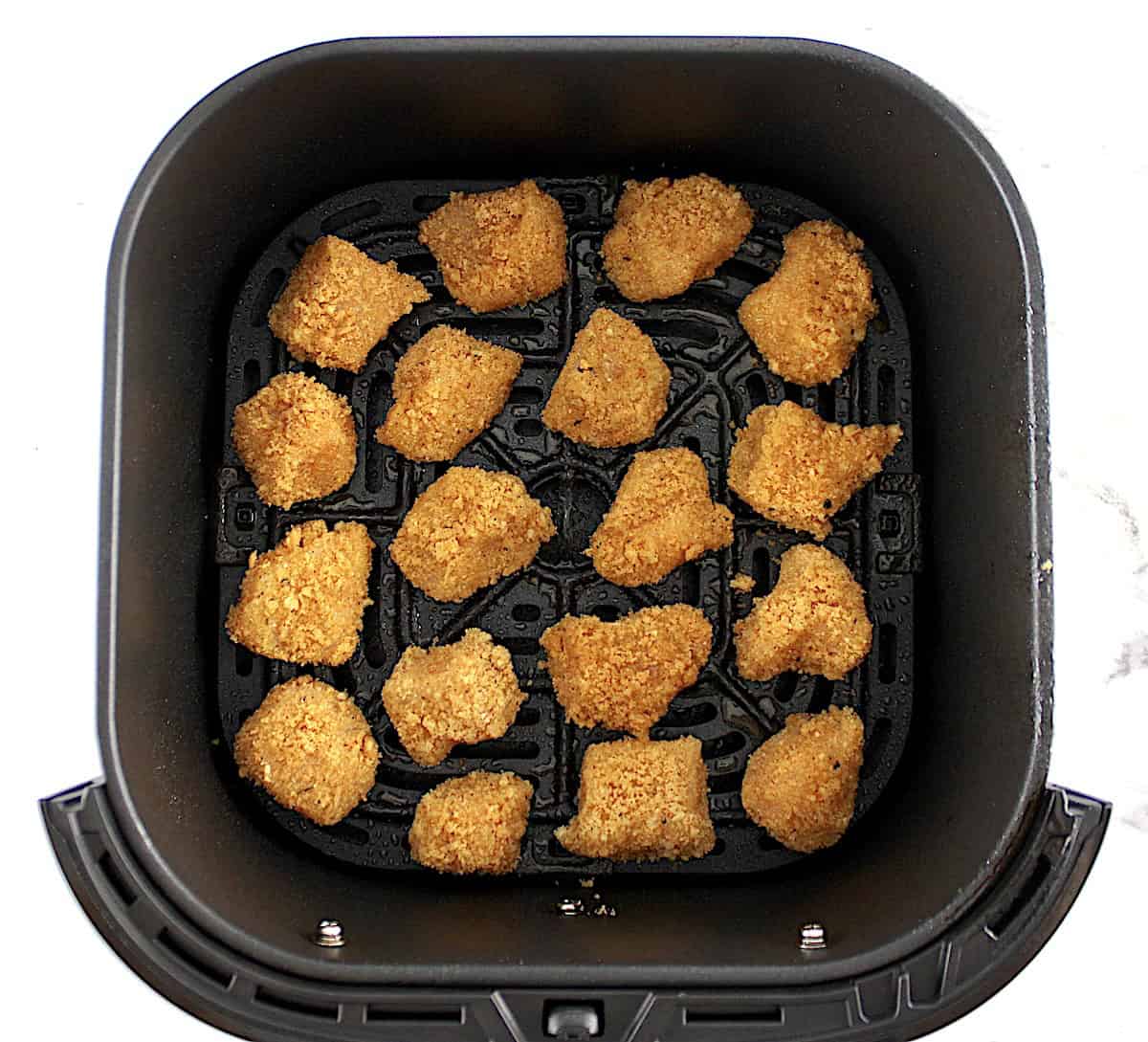 raw Air Fryer Chicken Nuggets in air fryer basket