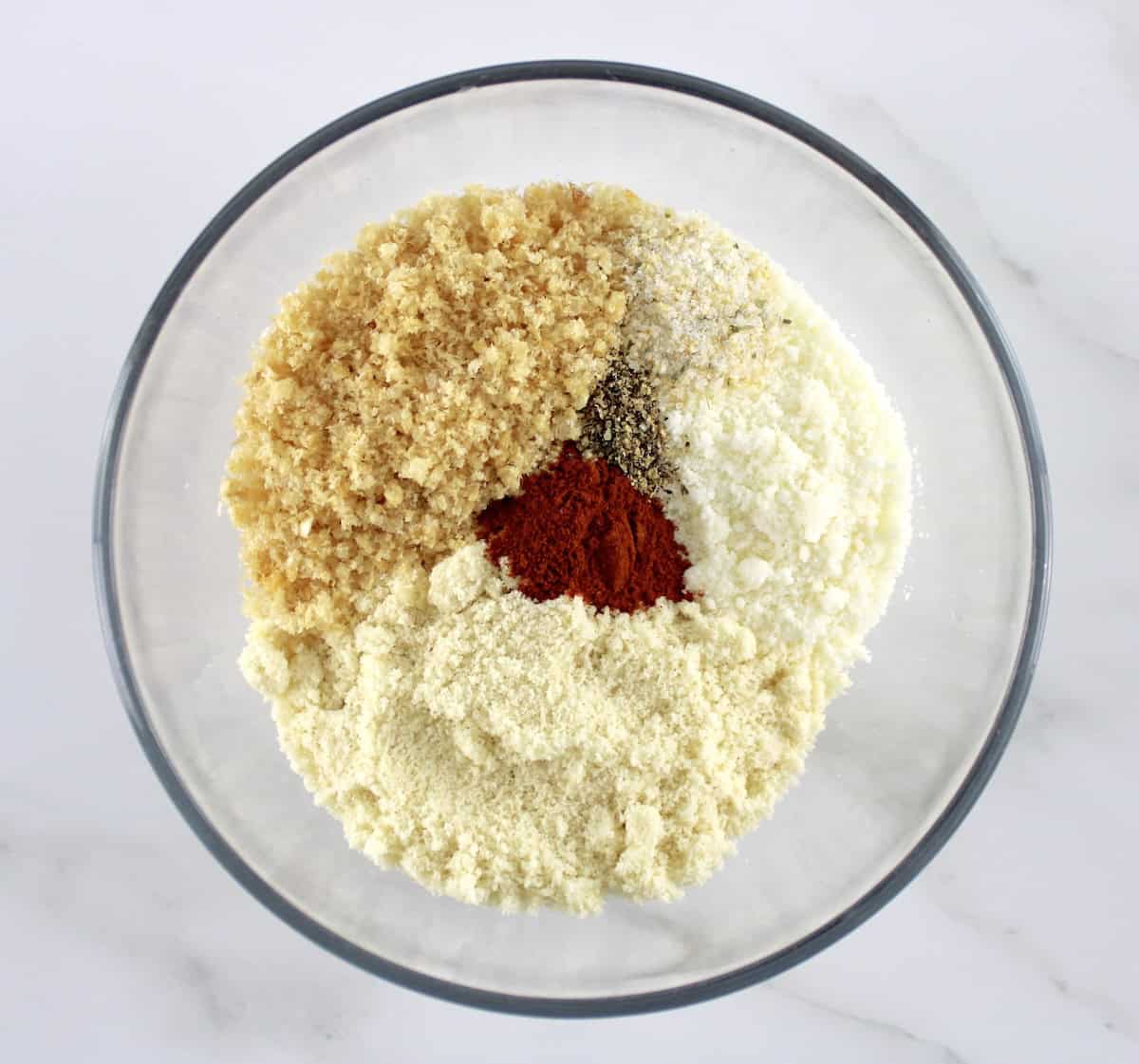 Air Fryer Chicken Nuggets breading ingredients in glass bowl unmixed