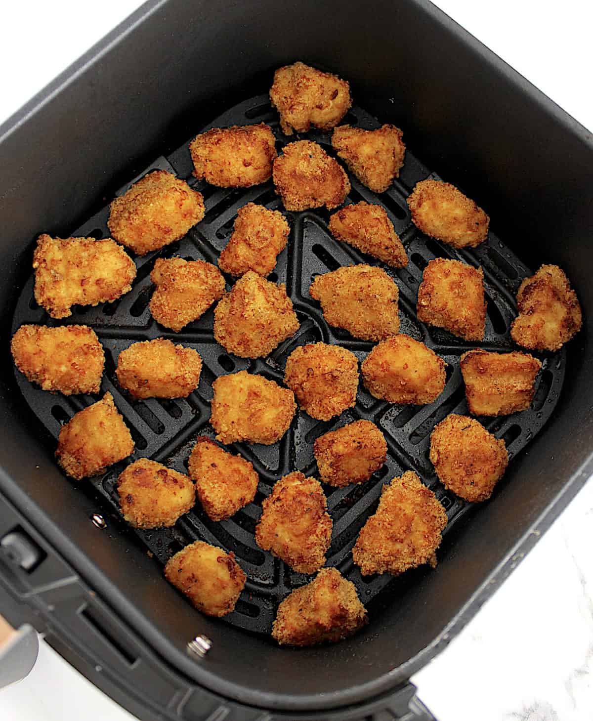 overhead view of Air Fryer Chicken Nuggets in air fryer basket