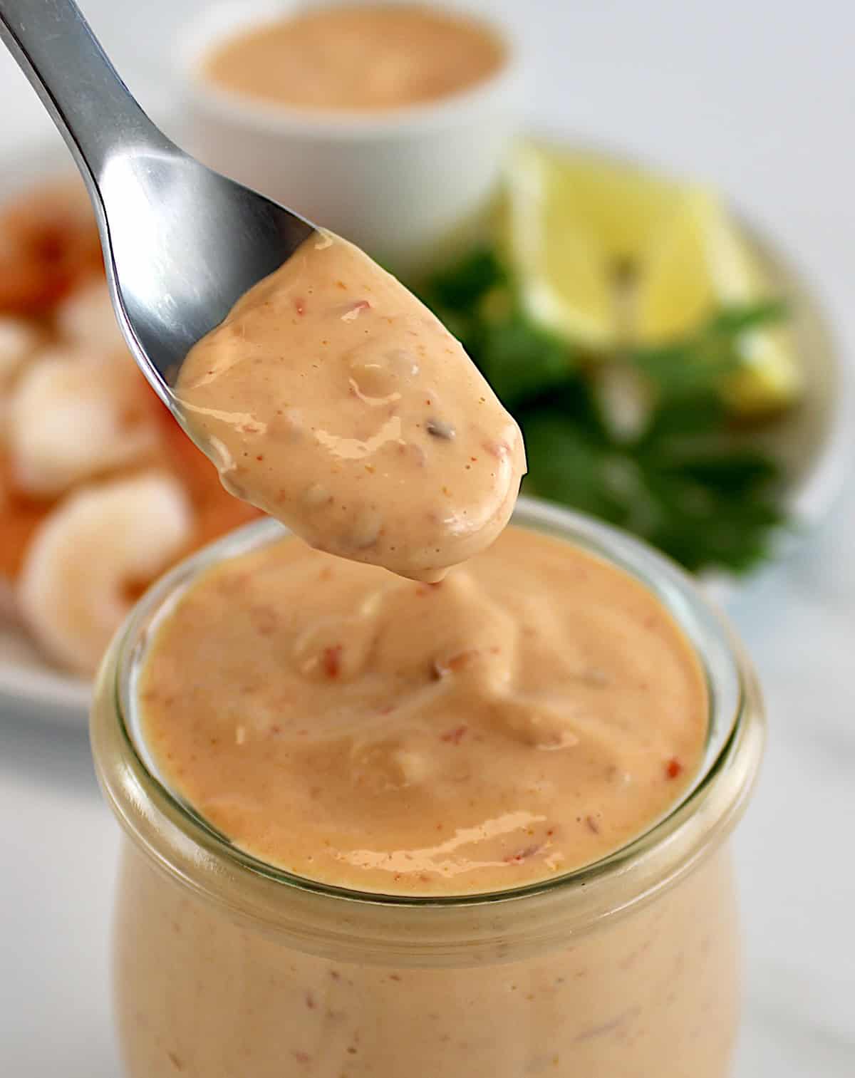 Boom Boom Sauce being spooned out of open glass jar