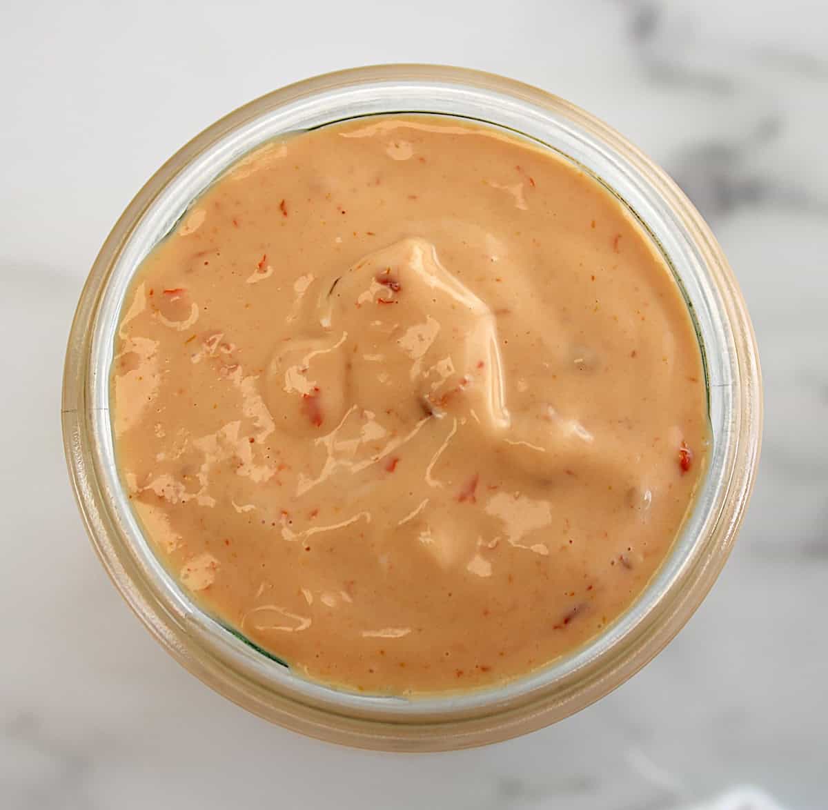 overhead view of Boom Boom Sauce in open glass jar