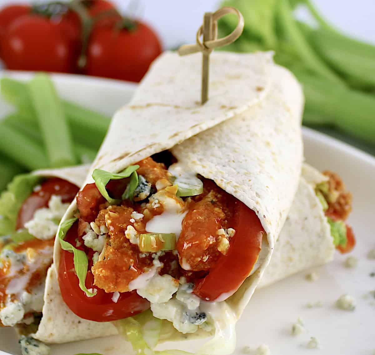 closeup of Buffalo Chicken Wrap with fancy toothpick on top