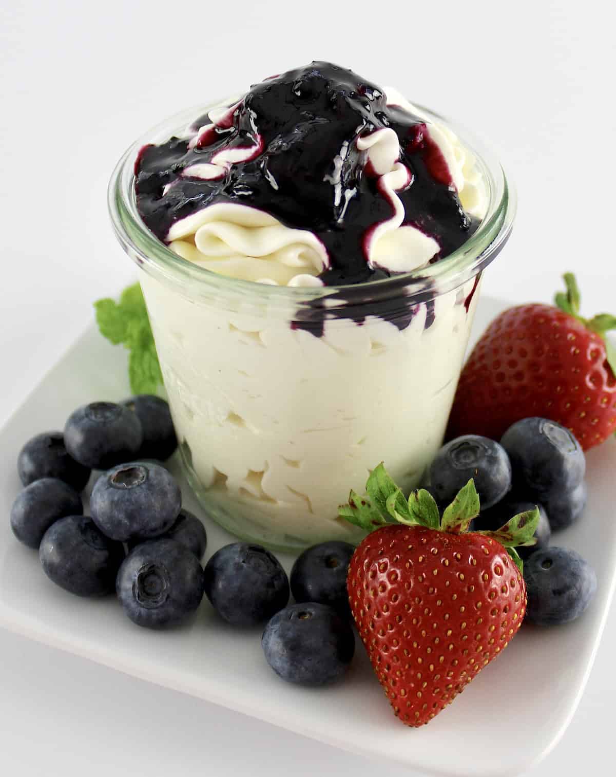 Keto Blueberry Sauce over cheesecake fluff in glass jar