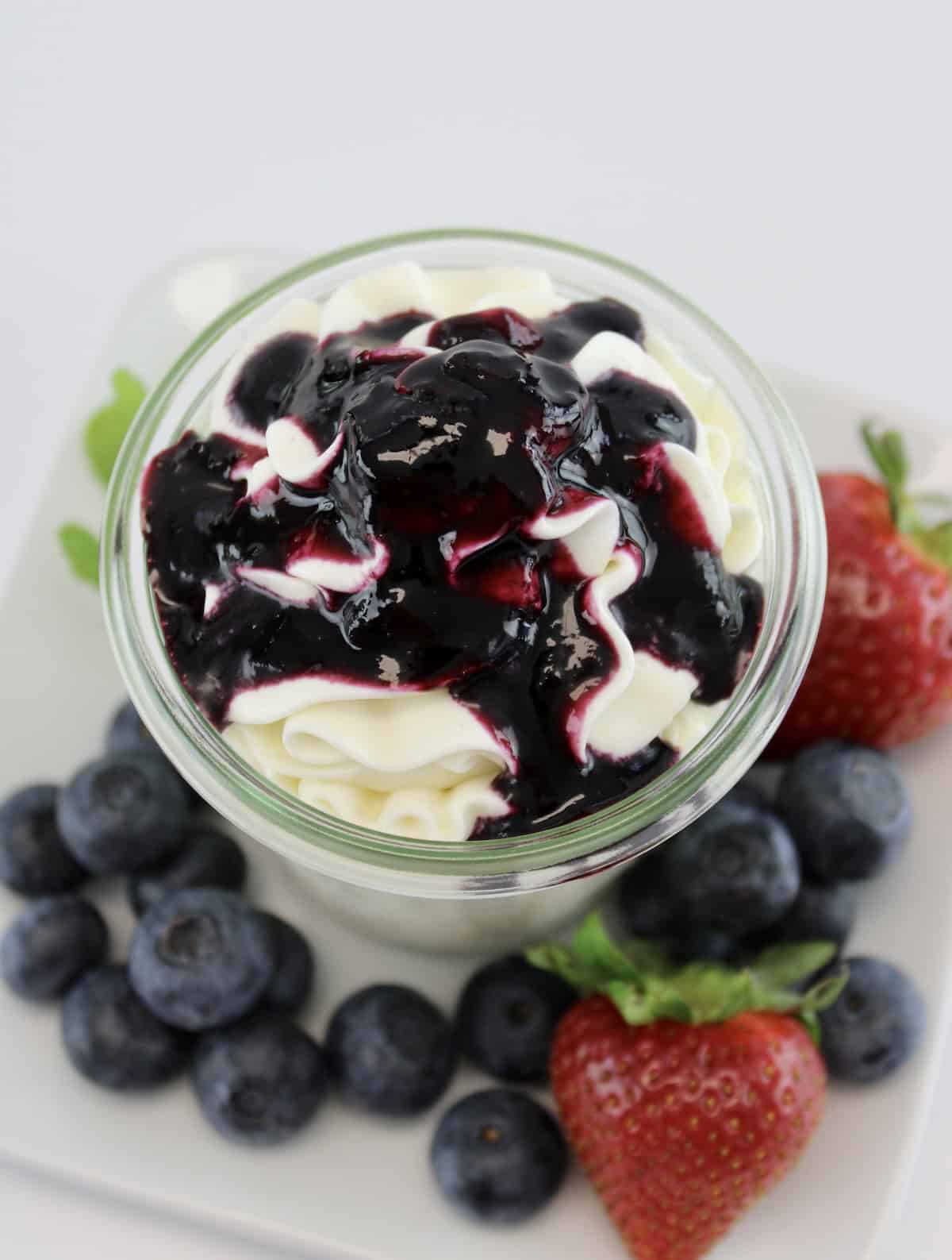 Keto Blueberry Sauce over cheesecake fluff in glass jar