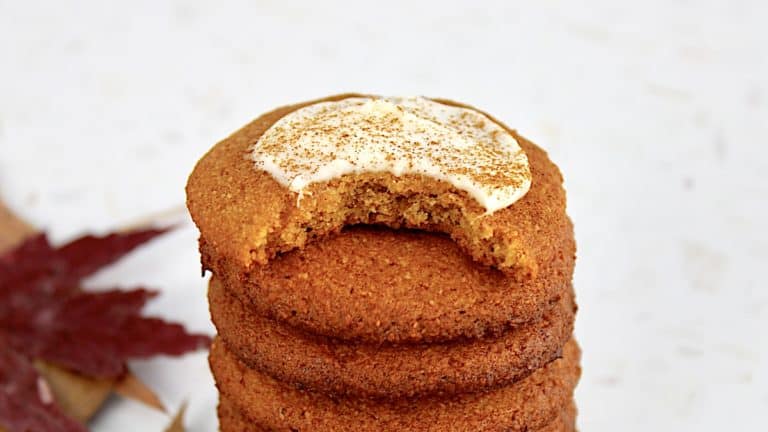 closeup of pumpkin cookies stacked with bite taken out