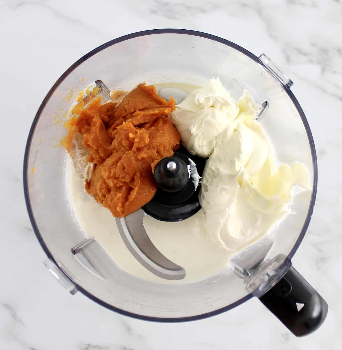 No-Churn Pumpkin Ice Cream ingredients in food processor bowl unmixed