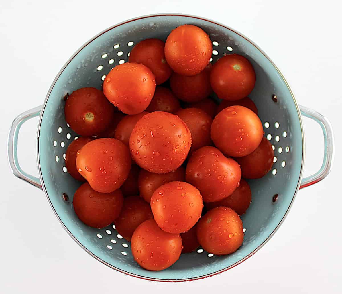 campari tomatoes in blue colander