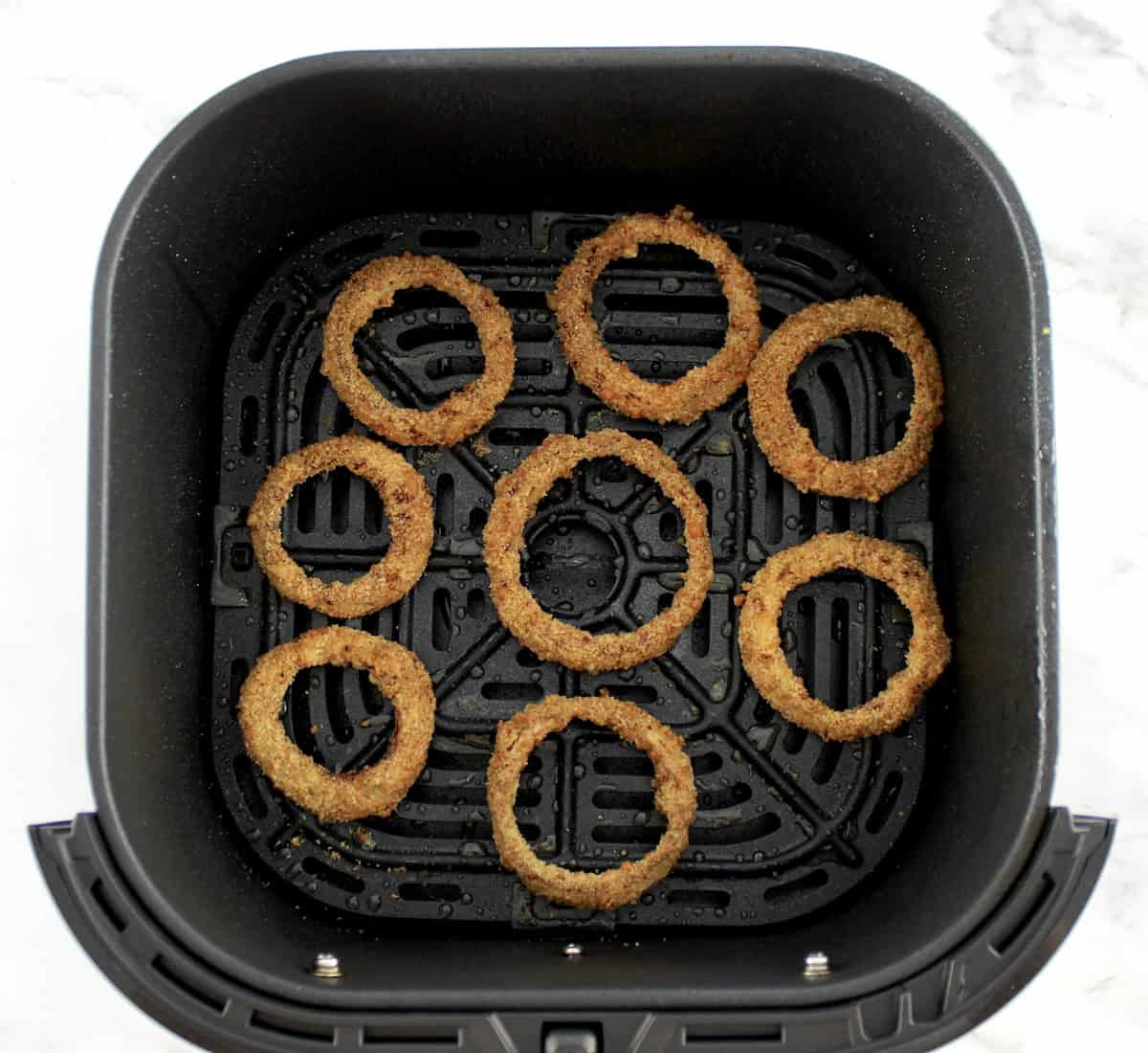 Air Fryer Onion Rings in air fryer basket