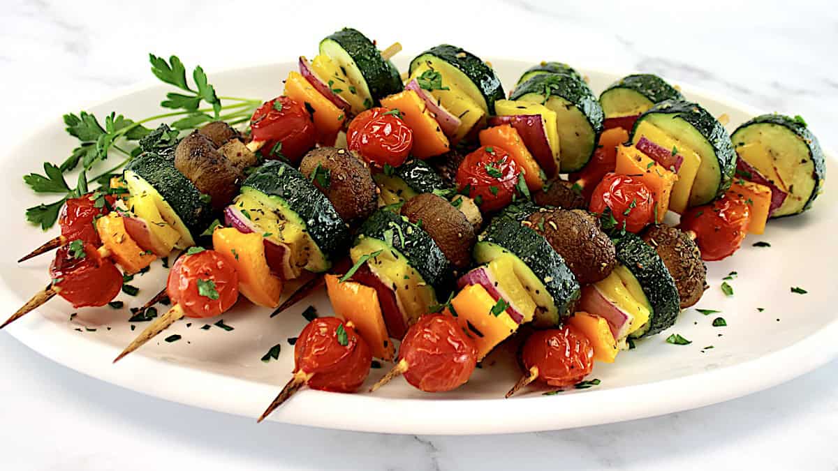 Air Fryer Veggie Kebabs on white plate with chopped parsley