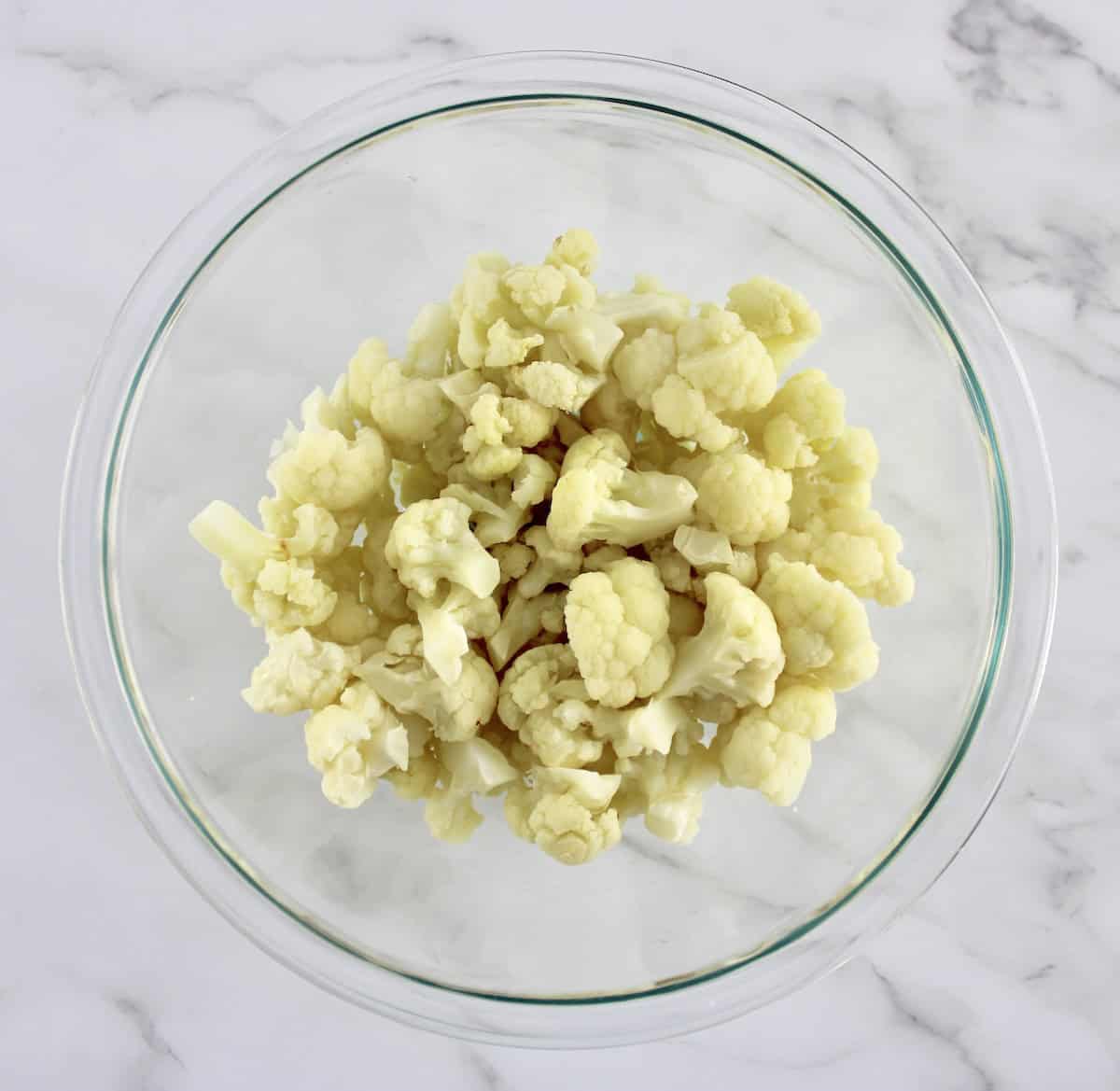 cooked cauliflower florets in glass bowl