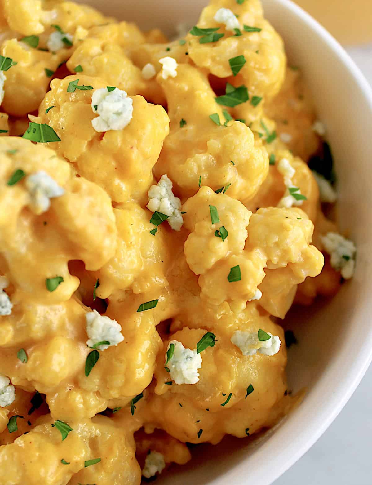 closeup of Buffalo Cauliflower Mac and Cheese in white bowl