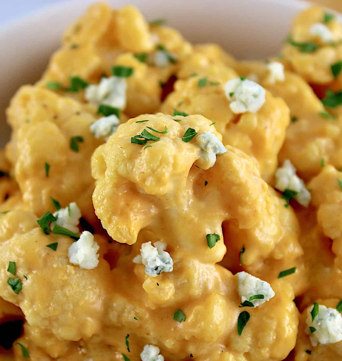 closeup of Buffalo Cauliflower Mac and Cheese with blue cheese crumbles