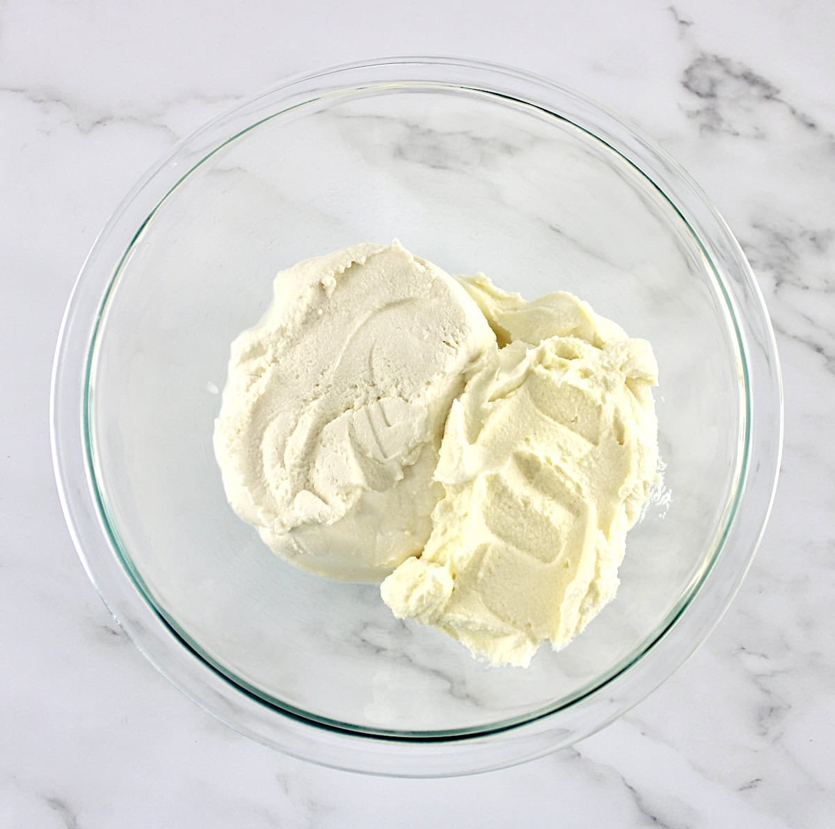 ricotta cheese and mascarpone cheese in glass bowl unmixed