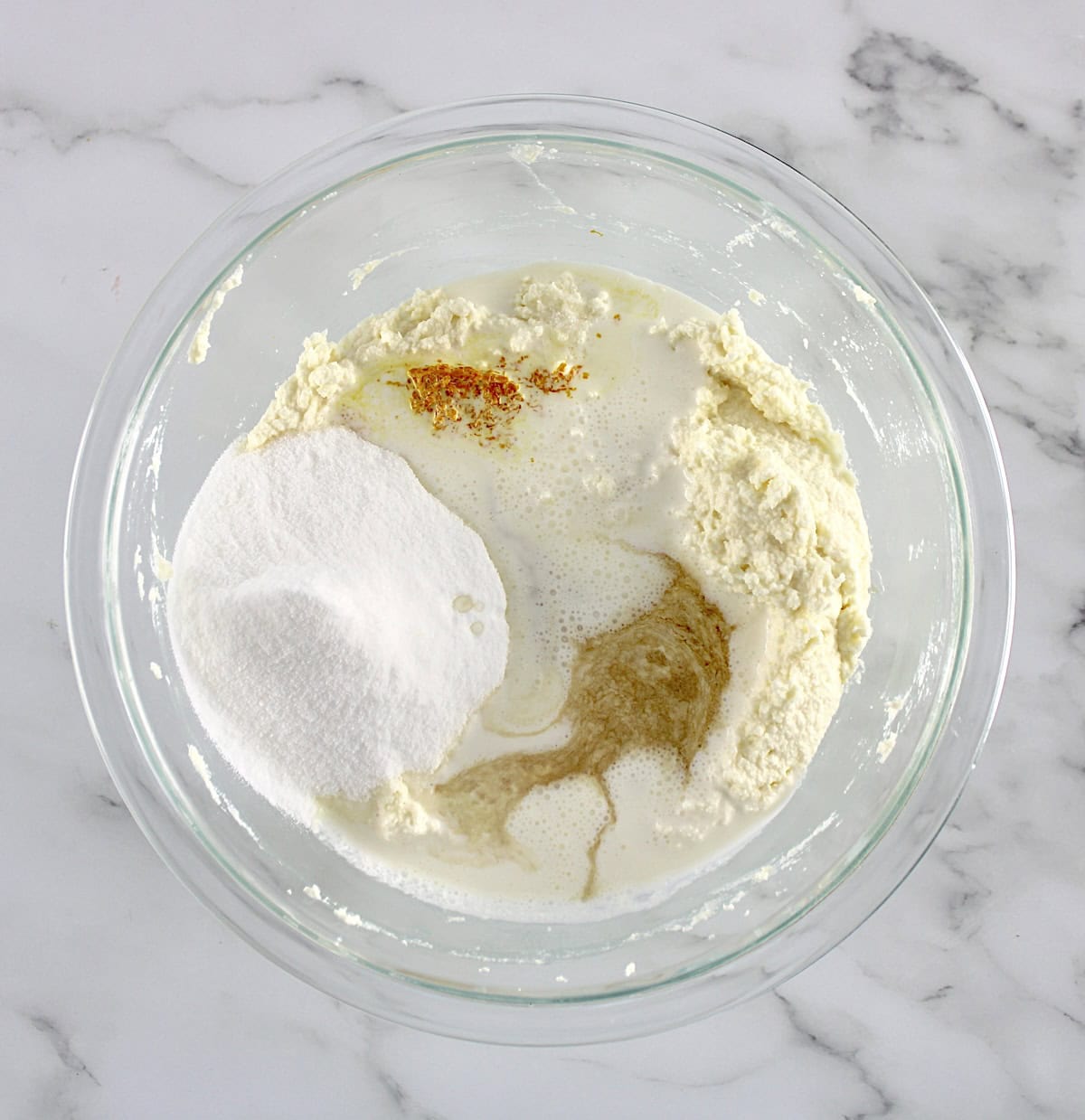 Cannoli Dip ingredients in glass bowl unmixed