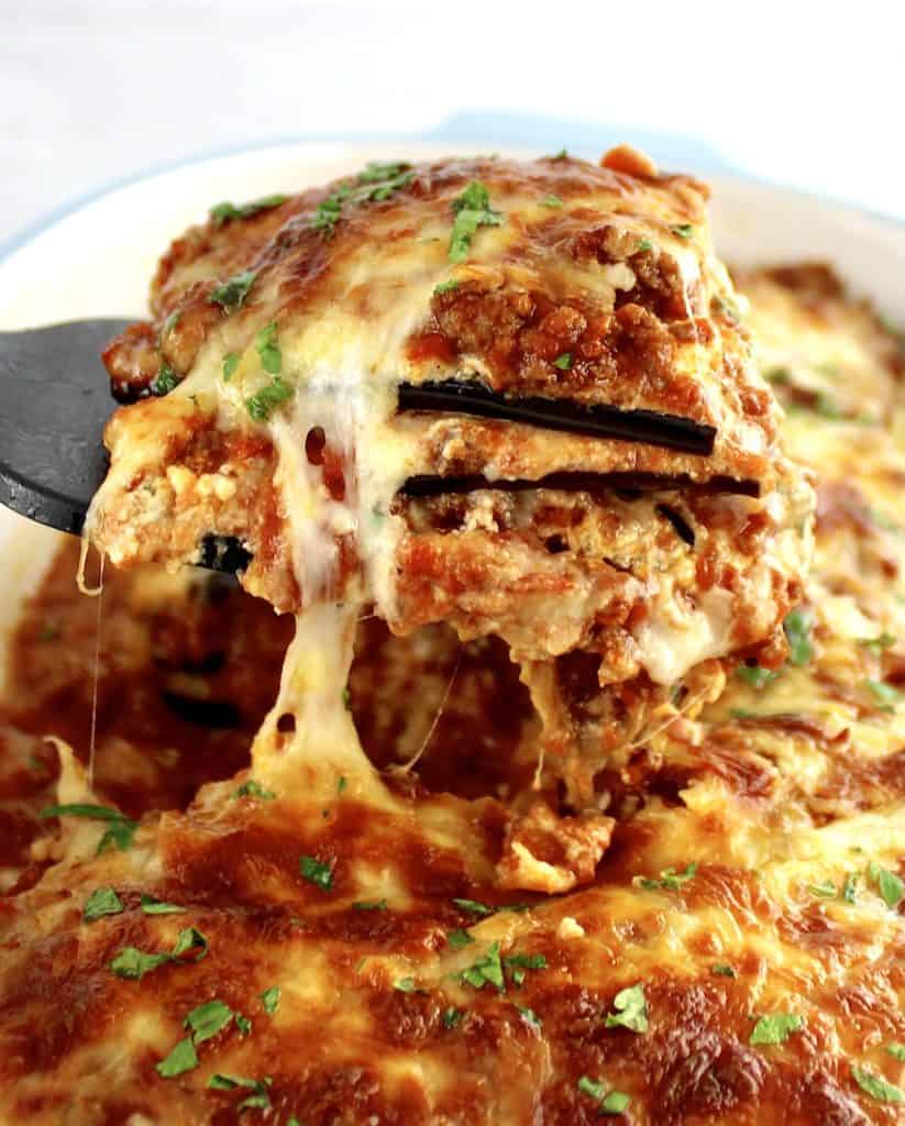 closeup of Eggplant Lasagna slice being lifted out of casserole