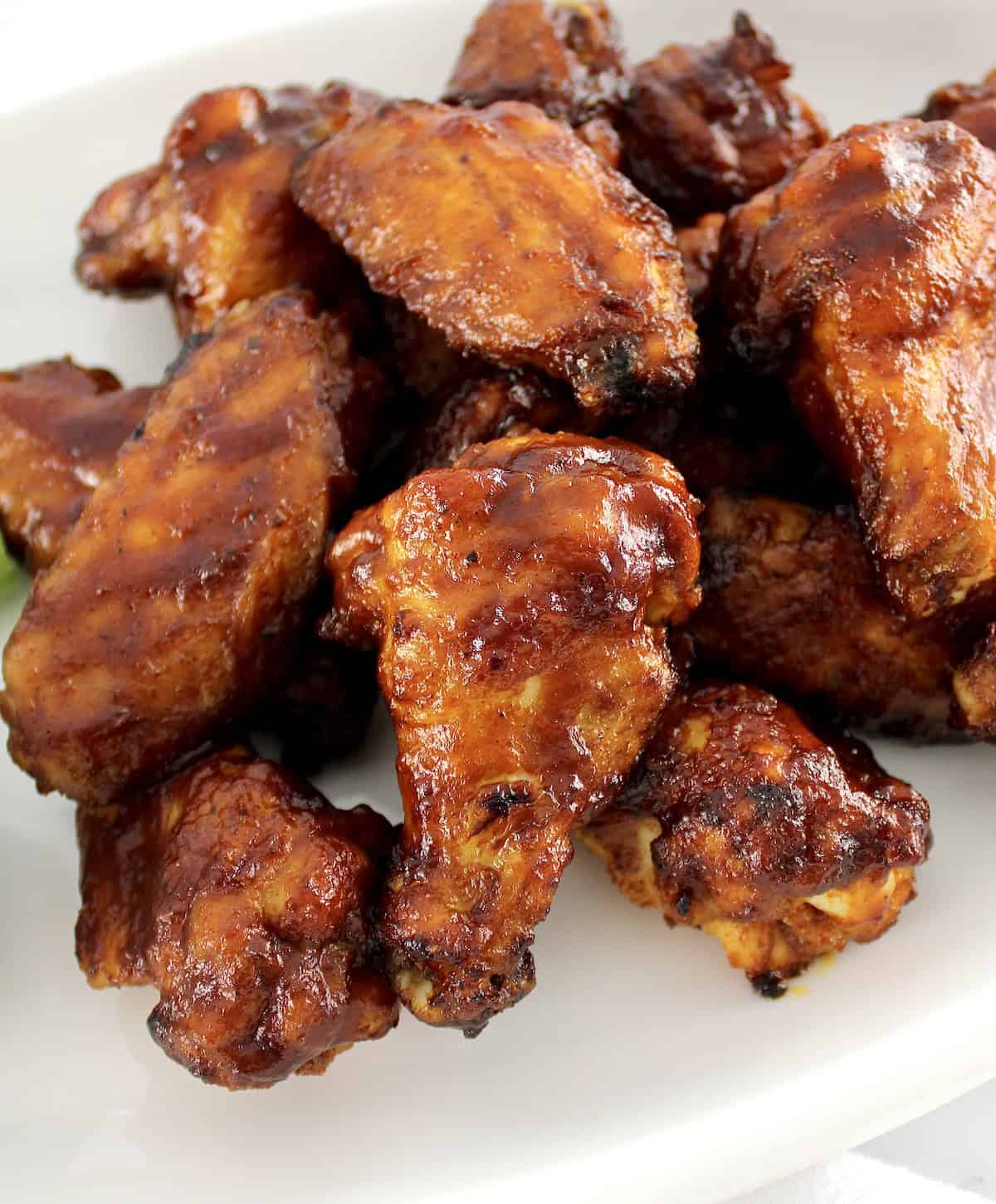 closeup of Honey BBQ Chicken Wings on white plate