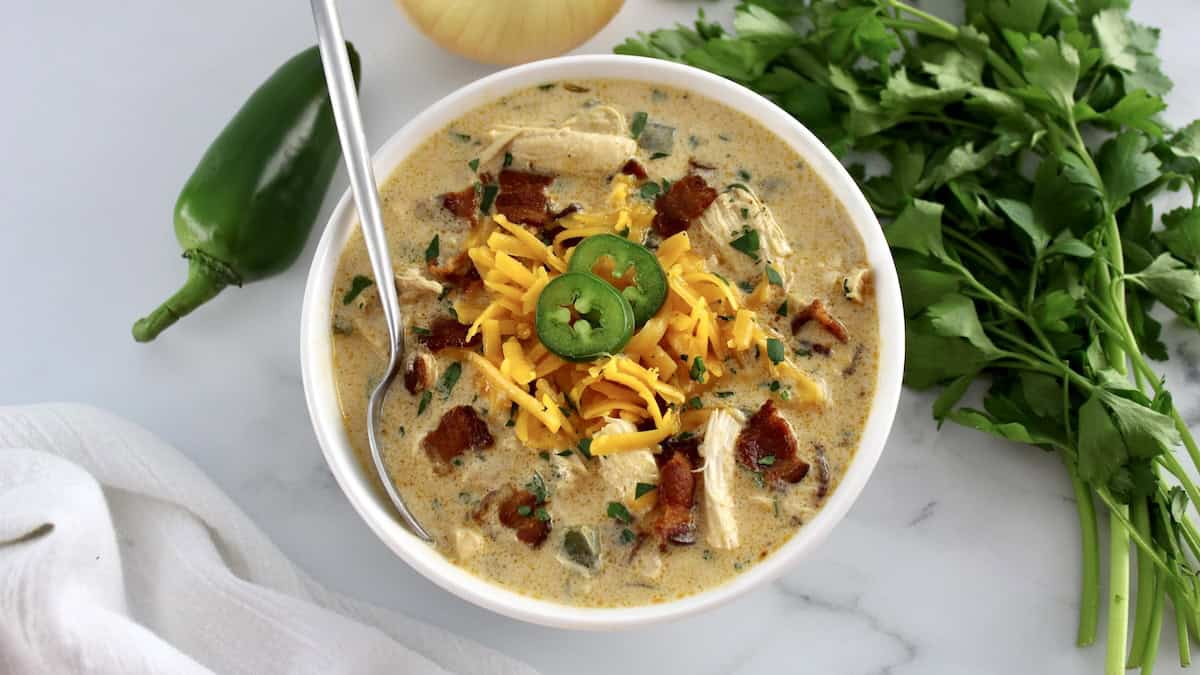 overhead view of Jalapeño Popper Chicken Soup with spoon