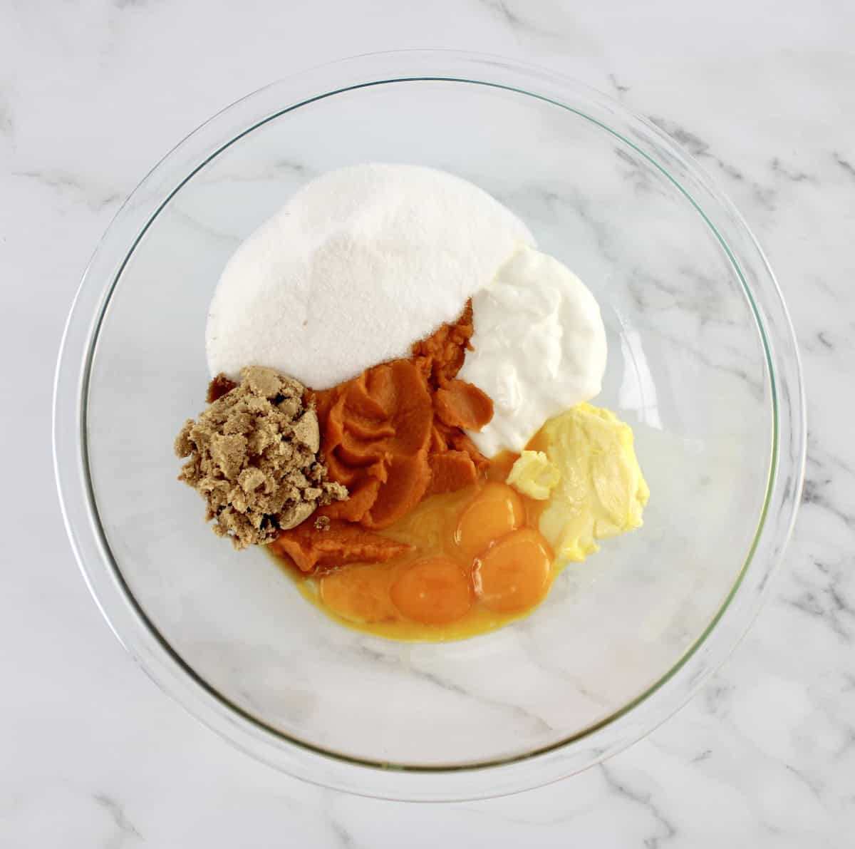 wet ingredients for Pumpkin Spice Cake in glass bowl unmixed