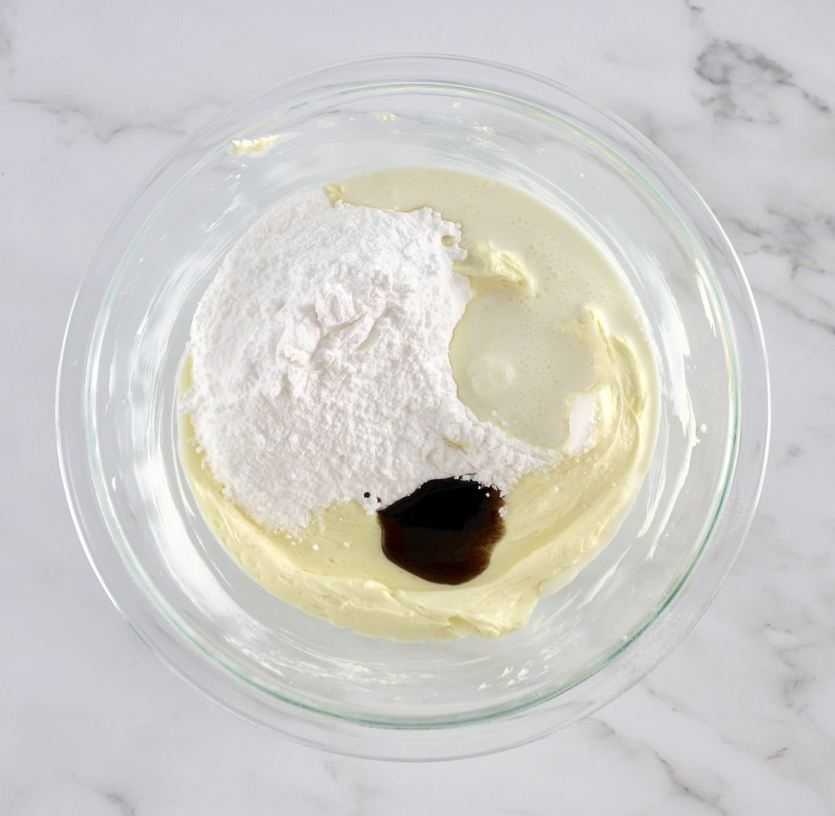 Pumpkin Spice Cake frosting ingredients in glass bowl unmixed